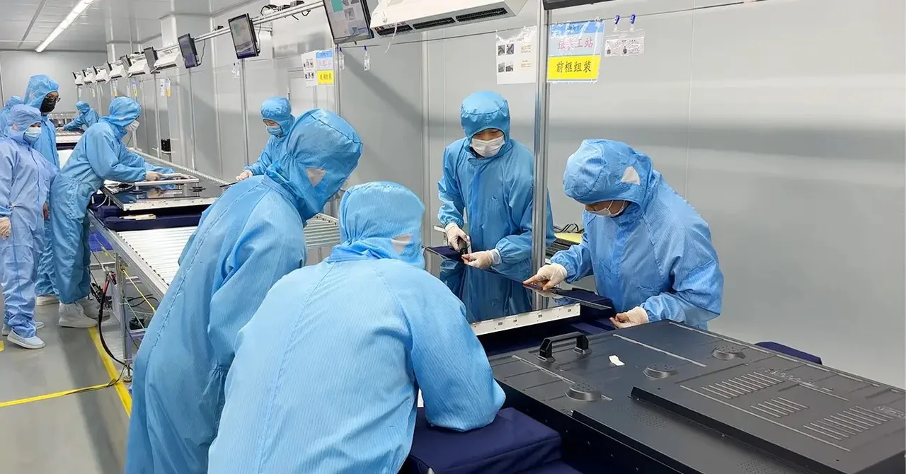 TZD Display workers assembling commercial LCD display panels on the production line